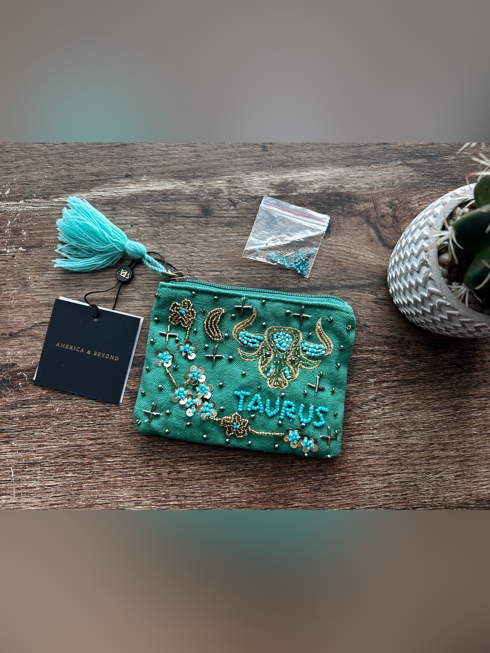 America & Beyond Taurus Beaded Wristlet in Teal